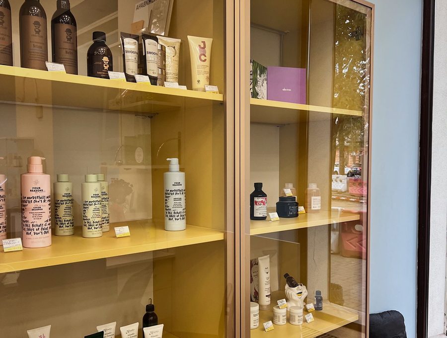 Hair and skincare products arranged on a retail shelf