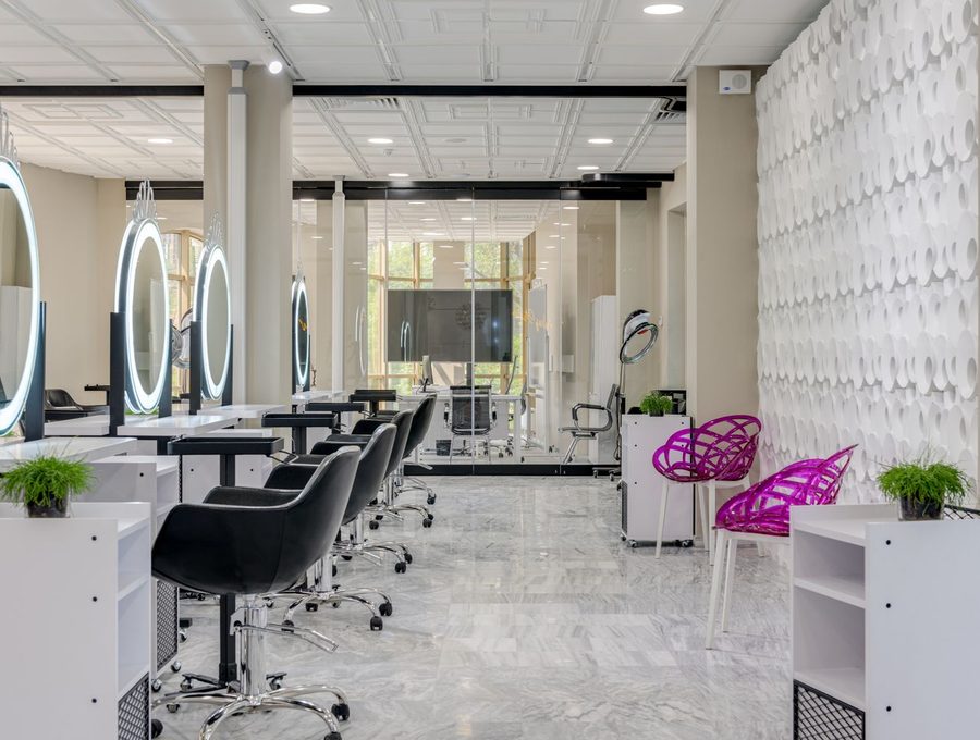 A styling station with a mirror in a bright salon