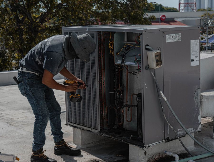 An engineer working on rooftop plant