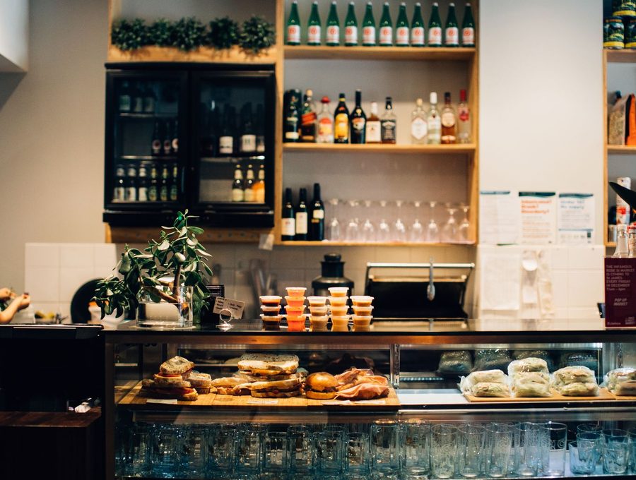 Drinks being poured behind a bar