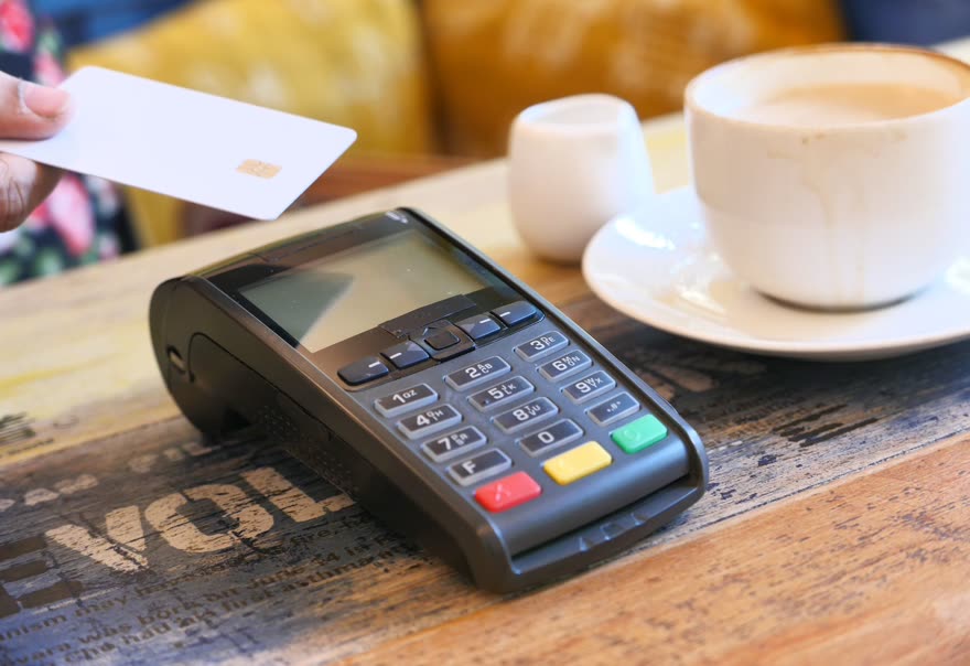 A countertop card terminal with a receipt printer
