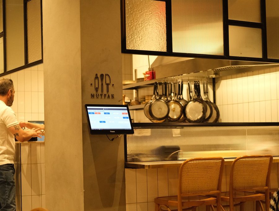 A warm dining room with a bar counter along one side
