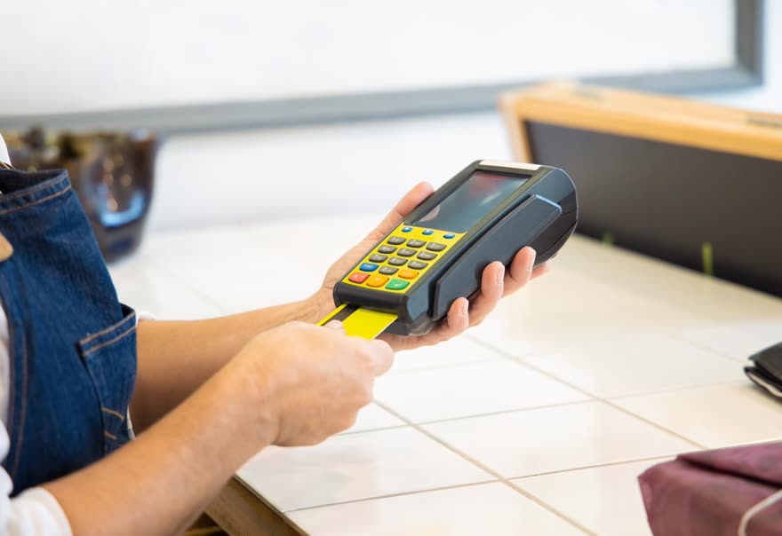 A card being inserted into a forecourt payment terminal